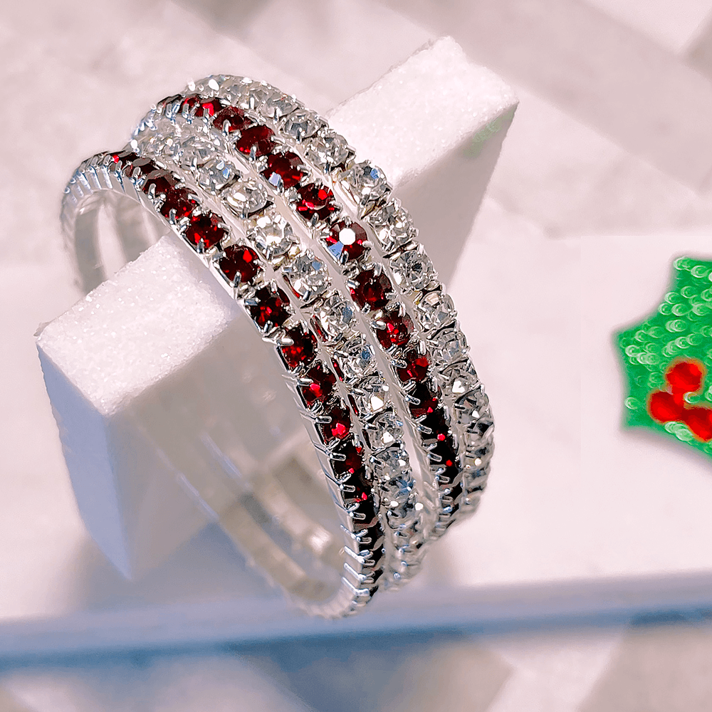 silver and red stone bracelets on display