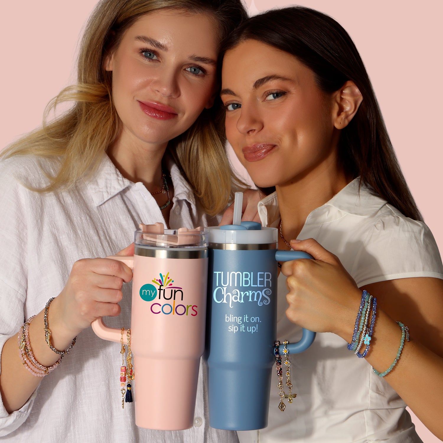 women holding colorful tumbler mugs with bracelets
