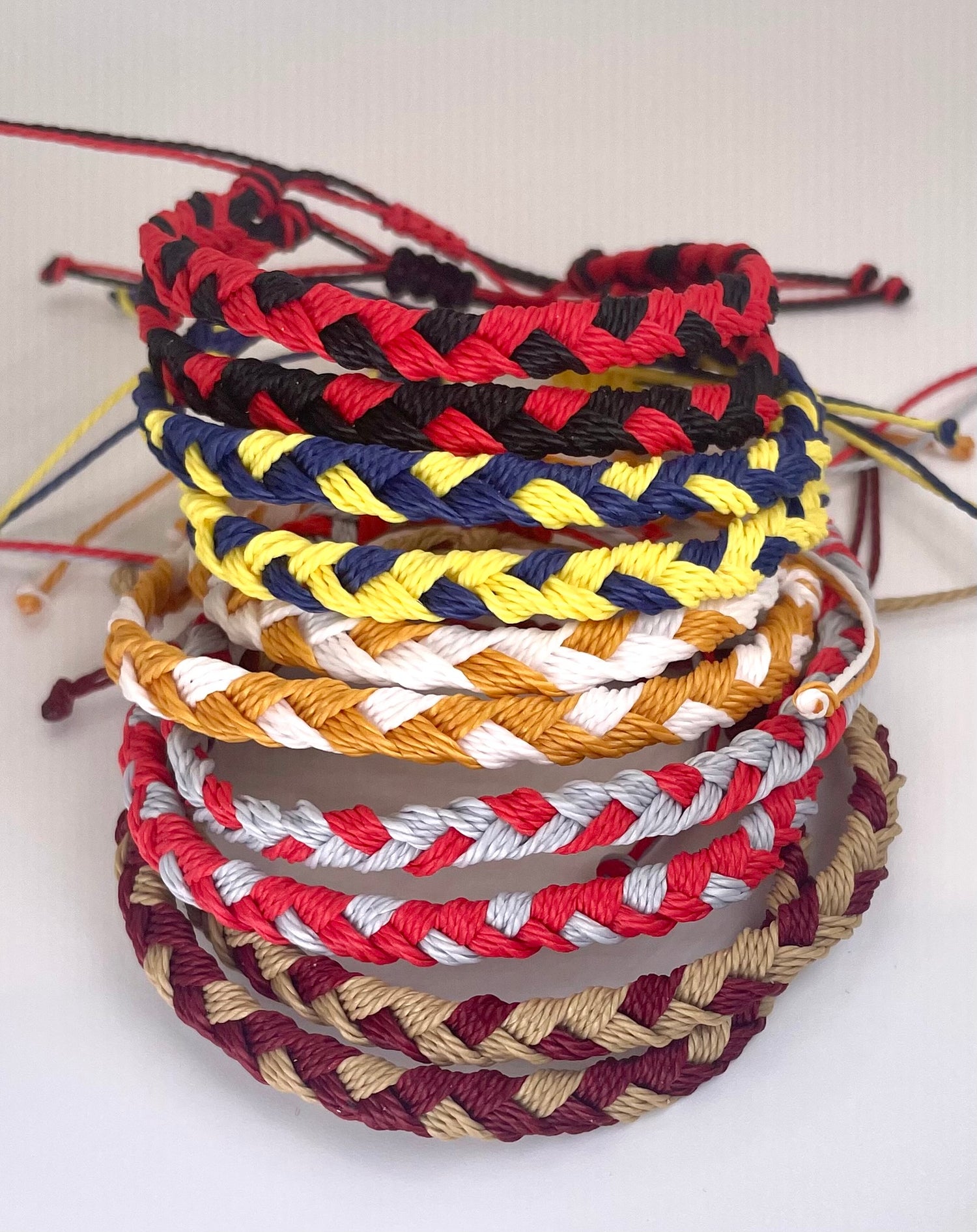 Hand braided bracelets in your favorite team colors.  It is a set of two bracelets.