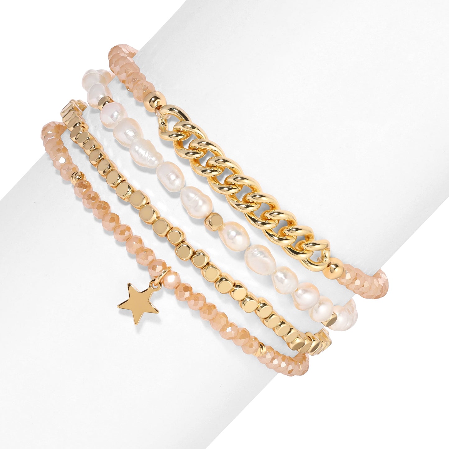 stacked gold bracelets with pearls and star charm