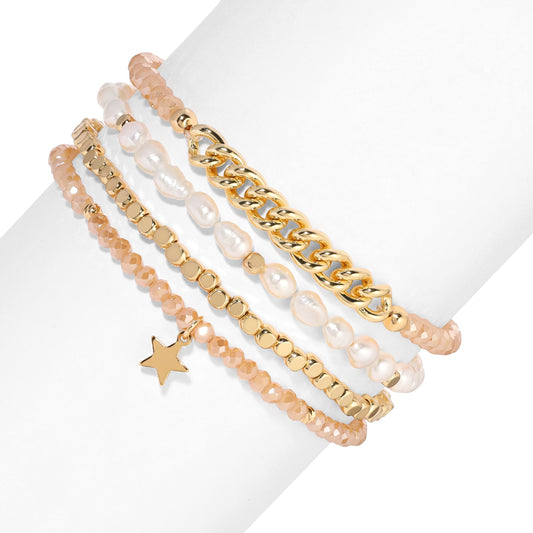 stacked gold bracelets with pearls and star charm