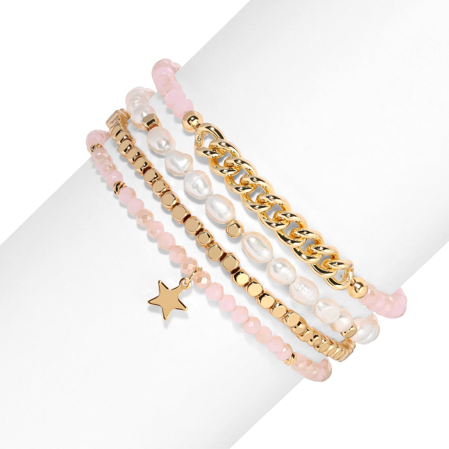 stack of gold pearl and pink bead bracelets on white background