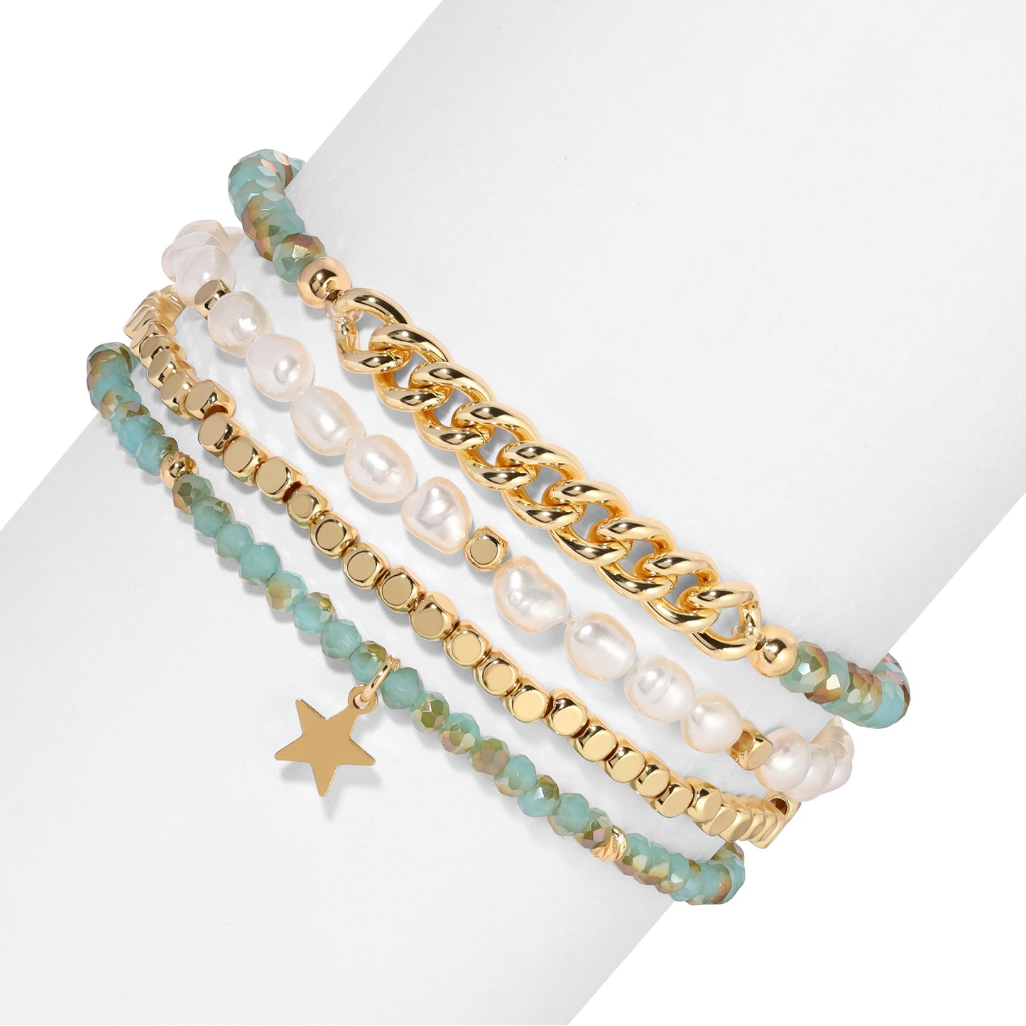 stacked gold and pearl bracelets with star charm