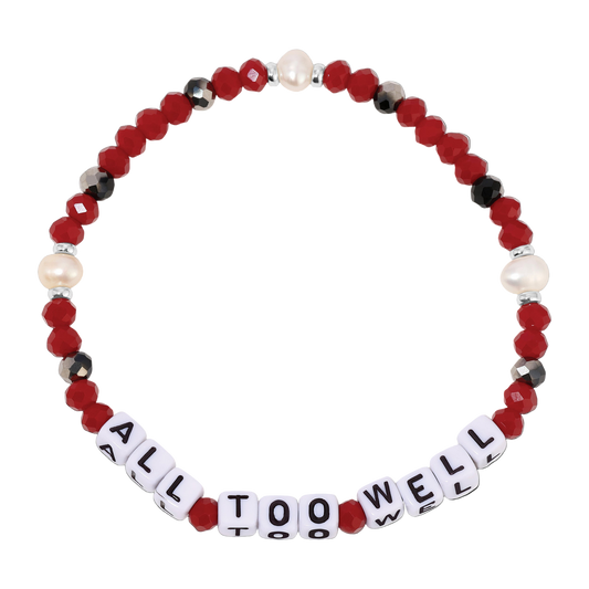 Beaded bracelet with 'All Too Well' message on a white background