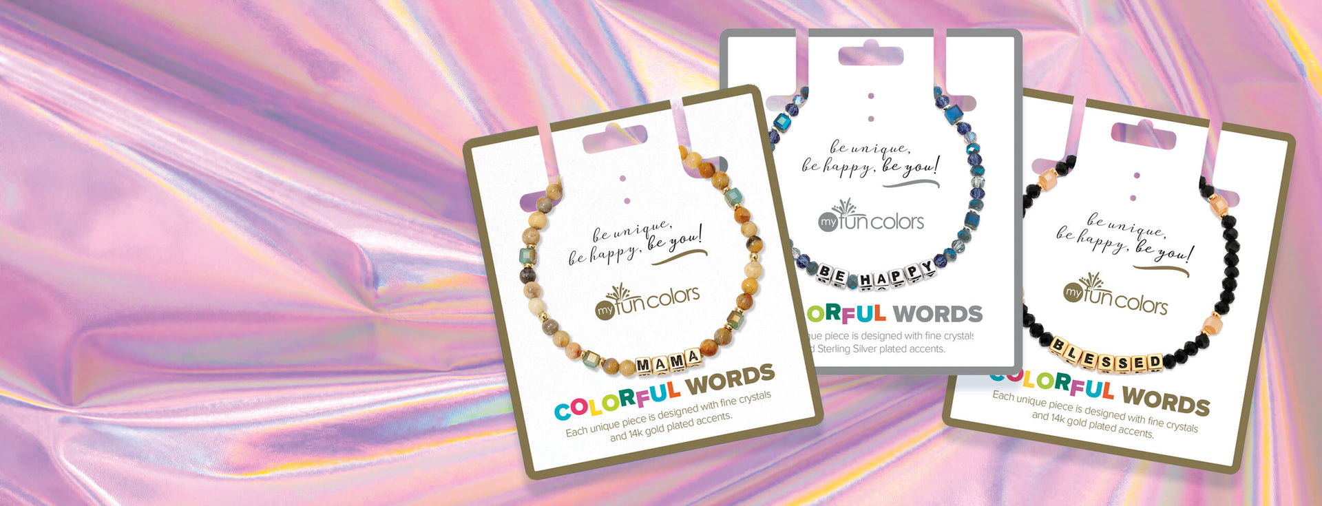 colorful bracelets on pink iridescent background