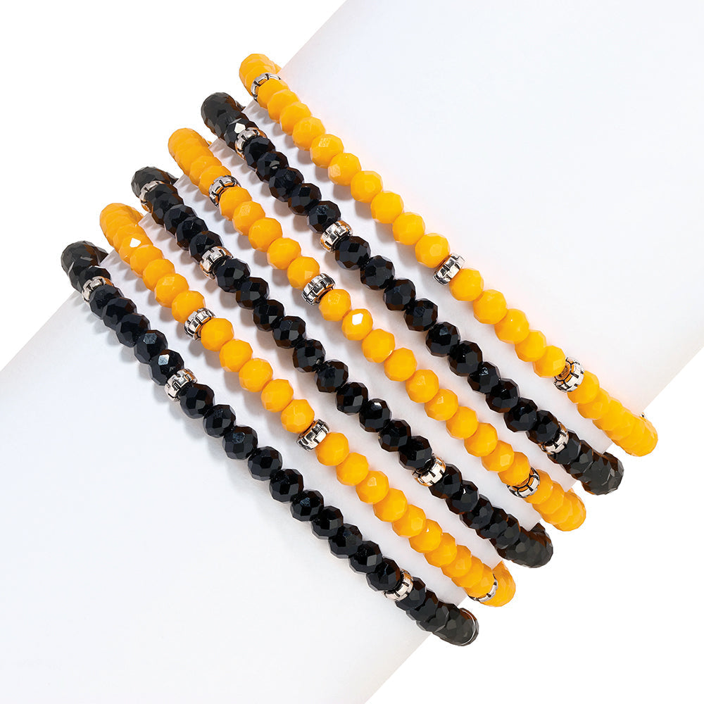 yellow and black beaded bracelets on white background