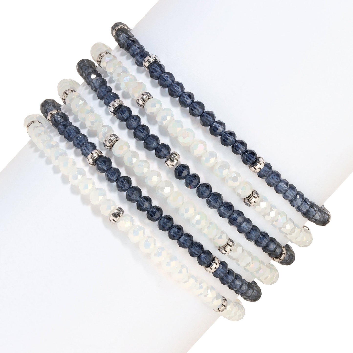 six beaded bracelets white and dark blue on white surface