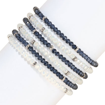 six beaded bracelets white and dark blue on white surface