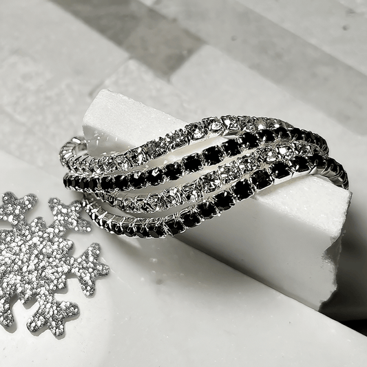 black and silver bracelet on white background