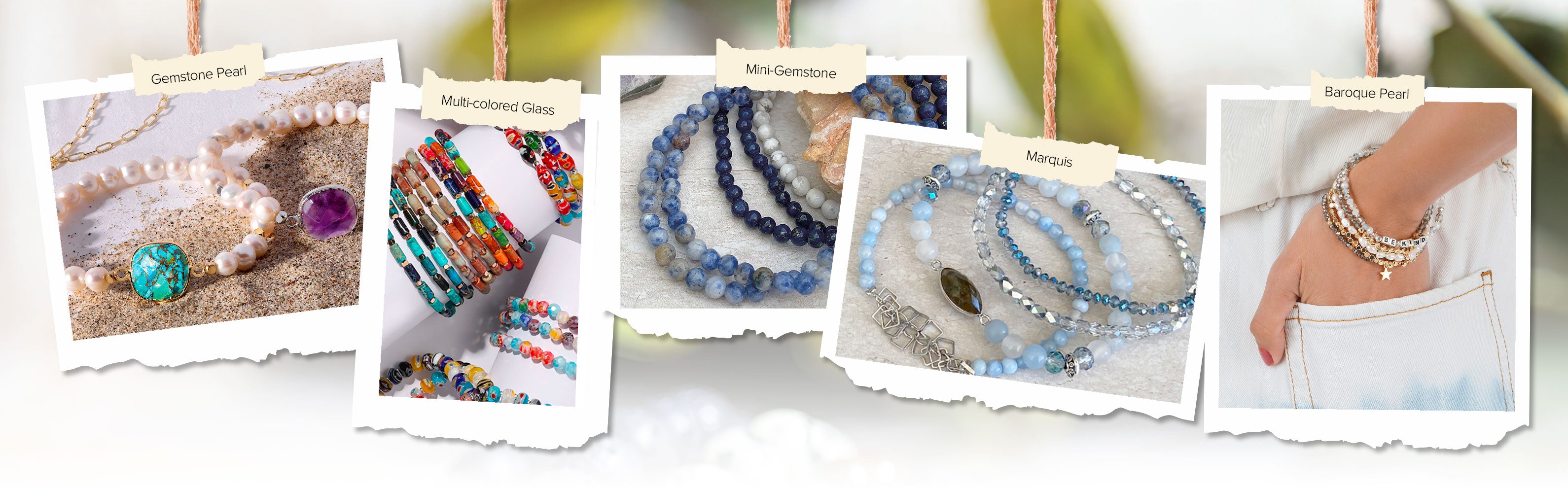 gemstone and pearl bracelets on sand and wrist