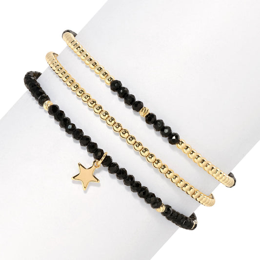 gold and black beaded bracelets with star charm